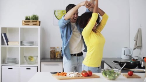 Happy Couple Dancing in the Kitchen