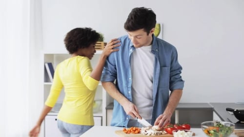Couple Preparing Healthy Meal in Bright Kitchen