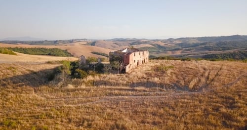 Ruined Building in Sunlit Fields