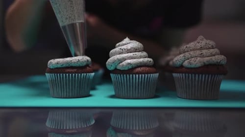 Decorating Chocolate Cupcakes with Cookies and Cream Frosting