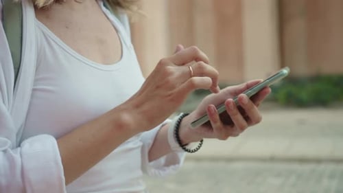 Woman Using Smartphone for Navigation in City