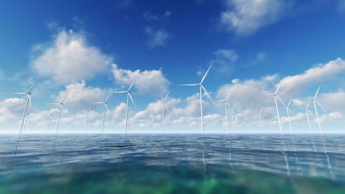 Offshore Wind Farm Turbines Spinning in Blue Ocean Landscape