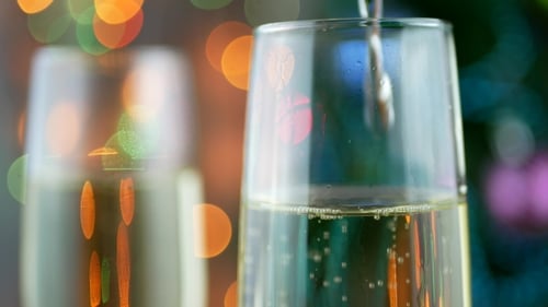 Champagne Being Poured into a Christmas Glass