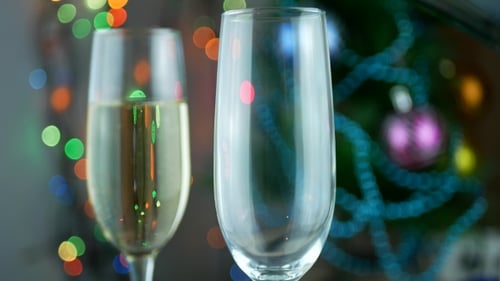 Champagne Being Poured for Christmas Celebration