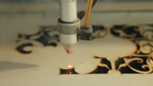 Laser Cutter Precisely Cuts Intricate Wood Designs