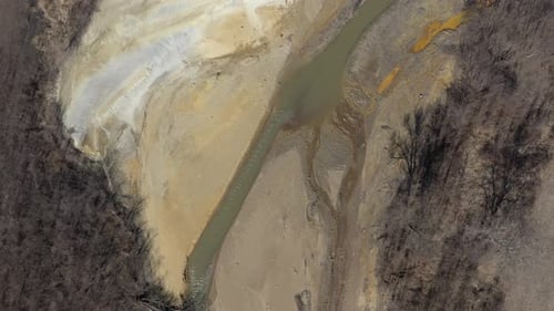 Mine drainage pyrite on polluted river coast 4K drone video