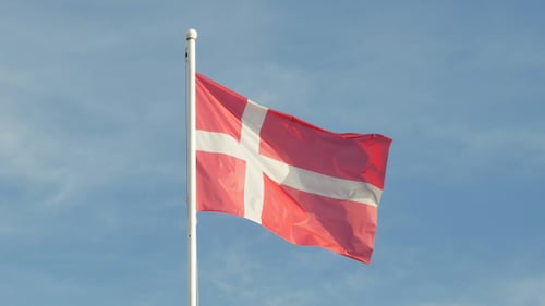 Red and White Flag Waving in the Wind