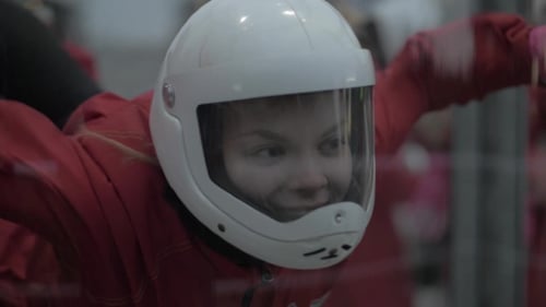 Portrait Young Woman Skydiver Flying in Wind Tunnel. Parachuting and Skydiving