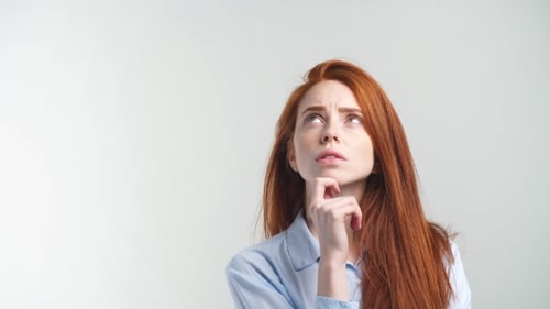 Woman Contemplating Deeply Looking Upward