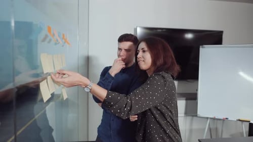 Teamwork of Project Manager Working with Agile Board in Office