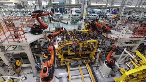 Robotic Arms Assembling Pieces in Manufacturing Factory