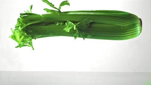 Super Slow Motion Celery Falls Into the Water with Splashes