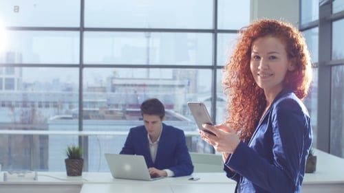 Portrait of Businesswoman Using Smartphone in Modern Office