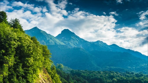 Green Mountains and Blue Sky with Clouds