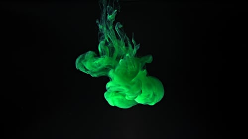 Green Ink Splash on Black Background