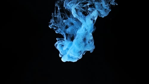 Abstract Blue Ink Swirling on Black Background