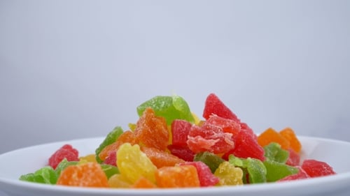 Colorful Candied Fruit Treats on White Plate