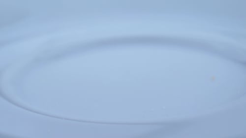 Bright Candied Fruit Falls Onto White Plate