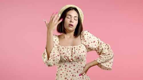 Young Woman Fanning Herself in Hot Weather