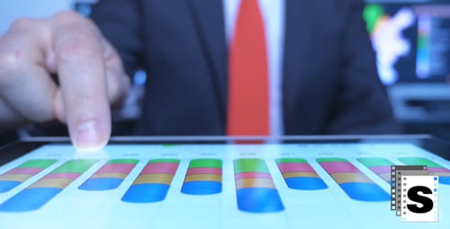 Business Data and Charts on Touch Screen Tablet
