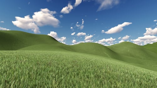 Lush Green Hills Landscape with Blue Sky and Clouds