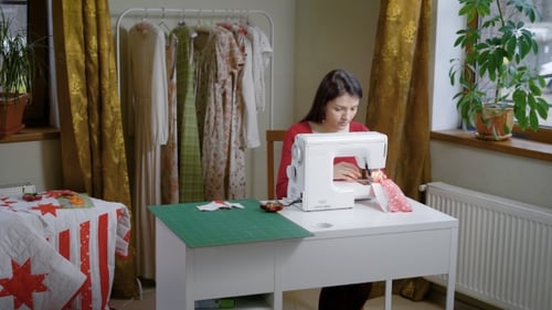 Tailor Is Carefully Working on a New Dress