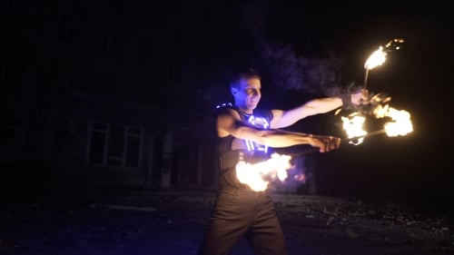 Adult Fire Dance at Night in Urban Area