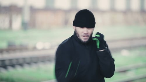 Young Boxer Shadow Boxing in the Street