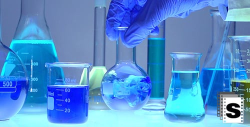 Scientific Laboratory Glassware with Liquid and Pipette