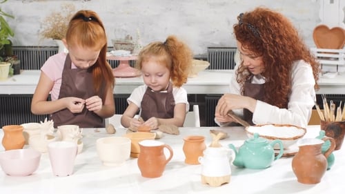 Pottery Class Workshop. Clay Shaping on Potter's Wheel and Firing.