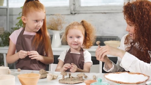 Pottery Class Workshop. Clay Shaping on Potter's Wheel and Firing.