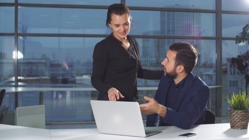 Teamwork in Modern Office with City View
