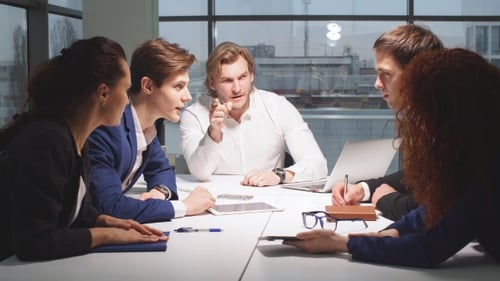 Business Team Meeting at Modern Conference Table