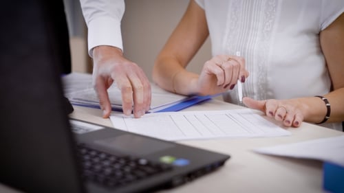 A Woman Shows the Changes in the Legal Documents for Her Boss, the Men's Hands Turn Over the Sheets