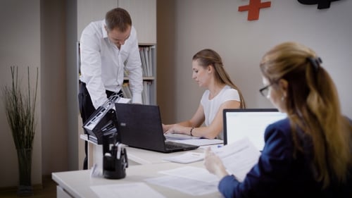 Several People Look at the Documents in the Office, the Man and the Woman Work in a Law Firm, They