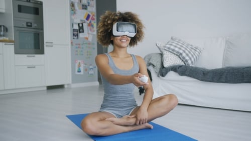 Woman Using VR Headset for Fitness at Home