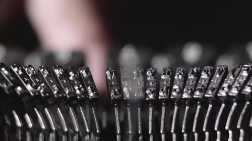 Close Up of Vintage Typewriter Keys Being Pressed