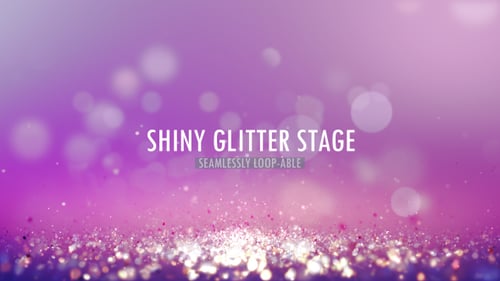 Sparkling Purple Glitter Particles with Bokeh Lights Background