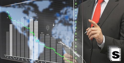 Man Analyzing Declining Graph in Business Suit