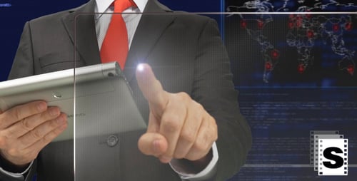 Suited Adult Using Tablet with Transparent Screen