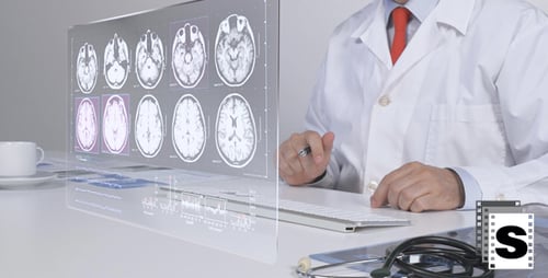 Doctor Analyzing Futuristic Medical Scans at Desk