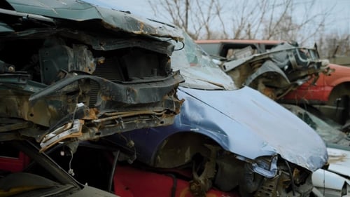 Wrecked Old Cars in Stacks