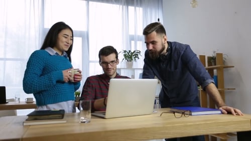 Group of Coworkers Sharing Ideas About New Project