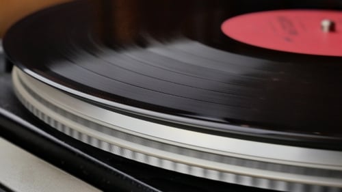 Vinyl Record Turning on Vintage Record Player