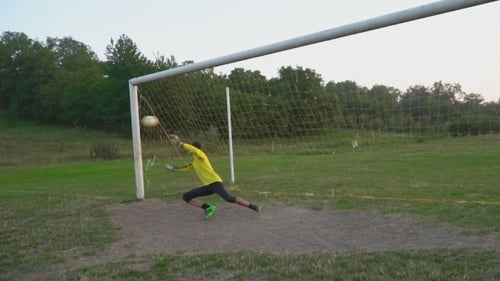 Young Man Playing Goalie in Soccer Field
