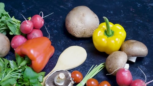 Organic and Fresh Vegetables on Dark Wooden Background