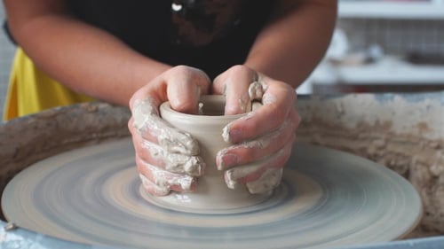 Pottery Class Workshop. Clay Shaping on Potter's Wheel and Firing.