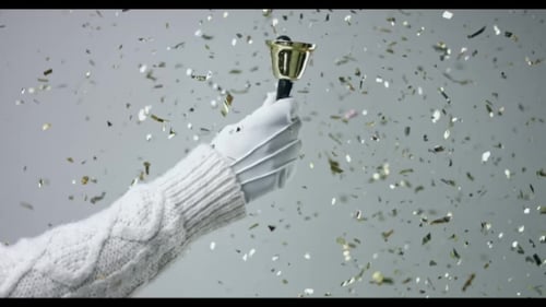 Golden Bell Ringer with Confetti Celebration