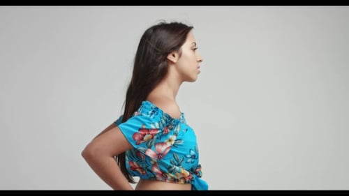 Smiling Woman Posing in Floral Print Top