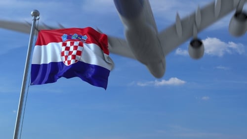 Realistic Waving Flag of Croatia Against Blue Sky